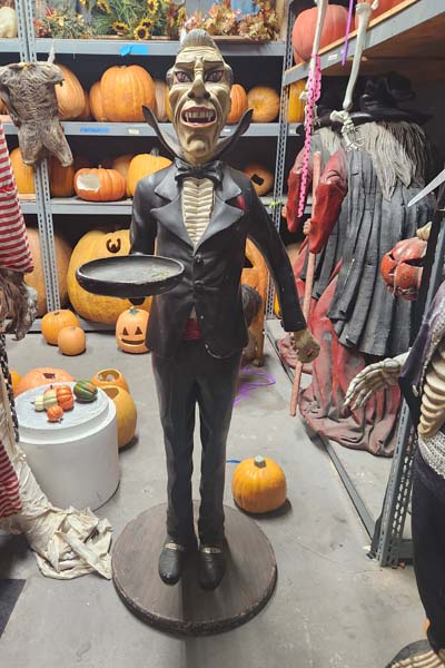 Dracula playing the butler with serving tray