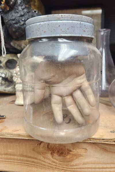 Electric glowing hand in jar