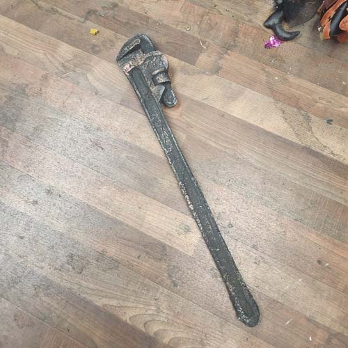 Long rusty plastic pipe wrench