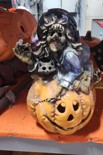 Ceramic witch and cat on pumpkin